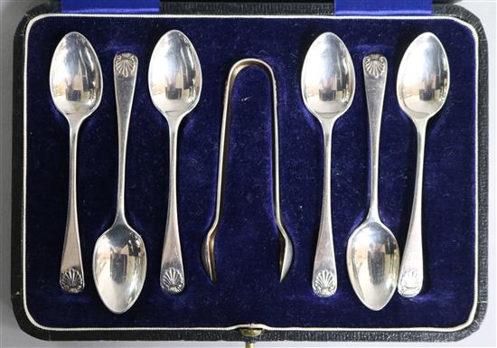 A cased set of six George V silver coffee spoons and tongs.